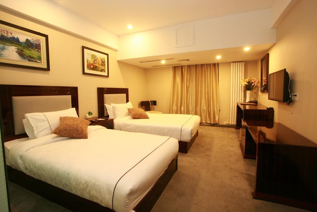 Harbin Yakelai Holiday Hotel Номер фото