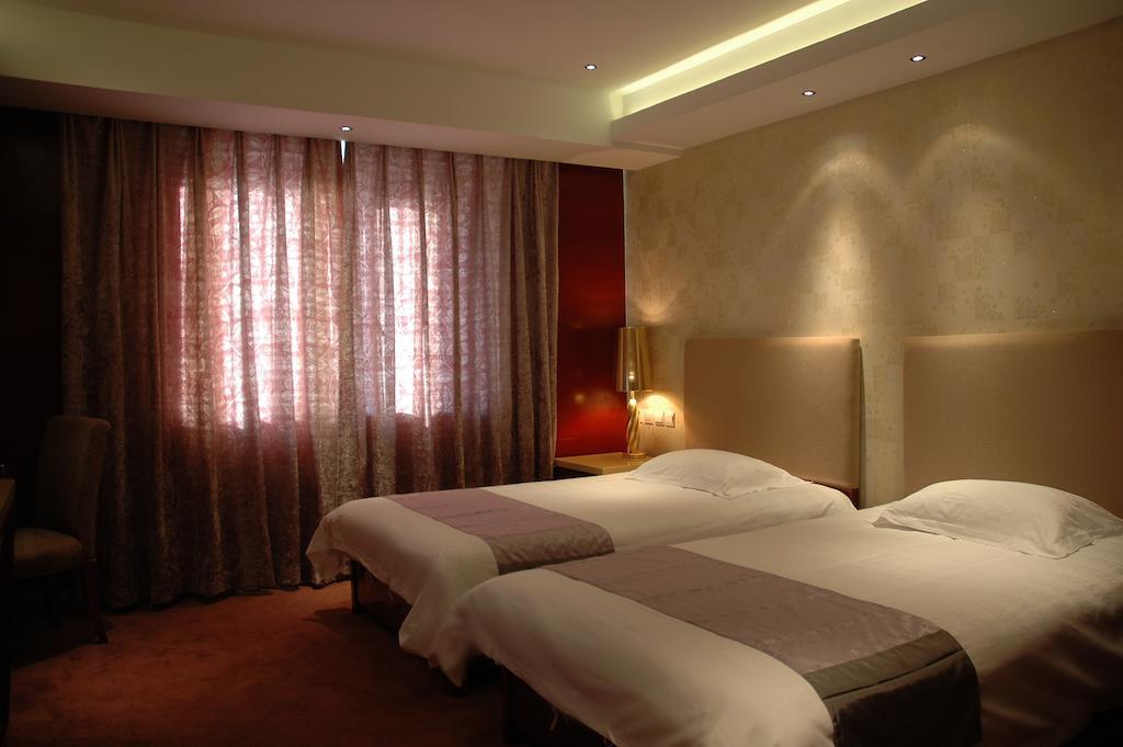 Harbin Yakelai Holiday Hotel Номер фото