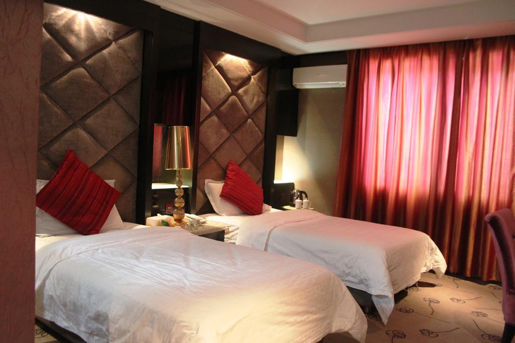 Harbin Yakelai Holiday Hotel Номер фото